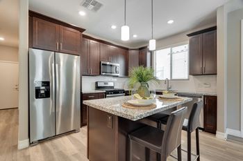 Kitchen with breakfast bar at Bella Victoria Apartments in Mesa Arizona January 2021